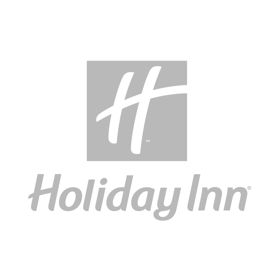 Holiday Inn logo featuring a stylized white H above the words Holiday Inn in white, all set against a gray background.